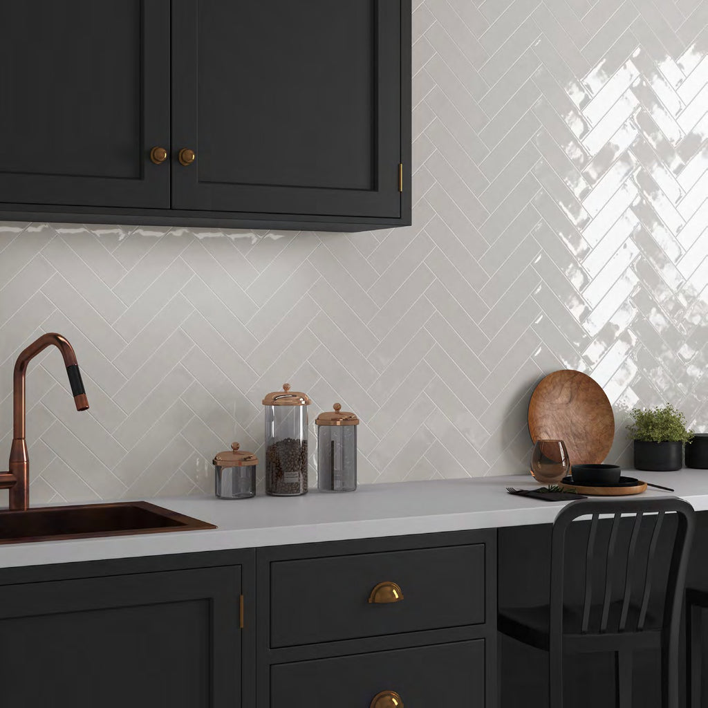 Cusp White Ceramic Wall Tile in a herringbone backsplash